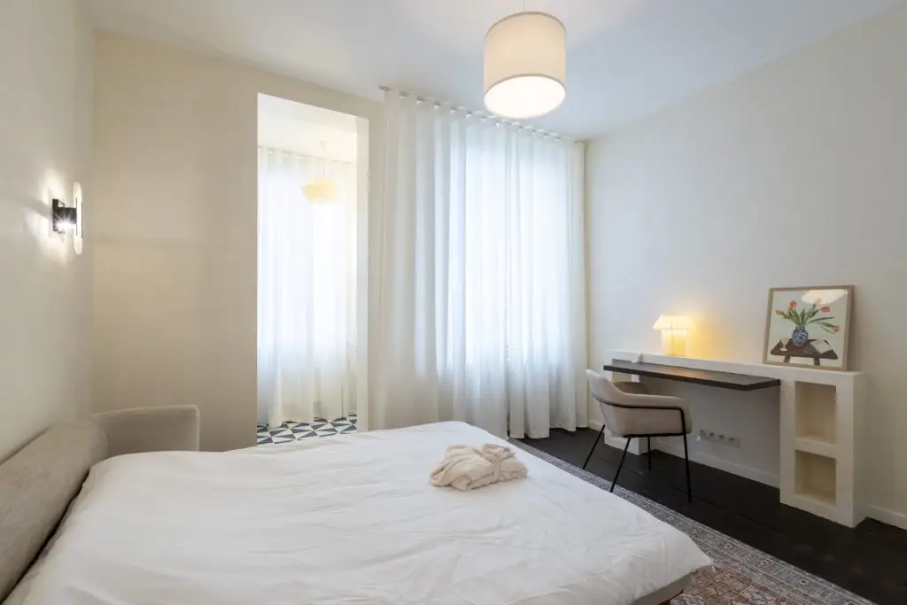 Elegant bedroom sanctuary in Garden House: lavish bed, sophisticated design, and unmatched comfort